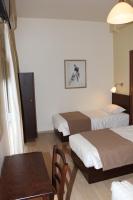 Postel nebo postele na pokoji v ubytování Rea Hotel