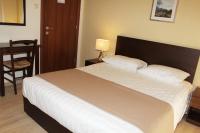 Postel nebo postele na pokoji v ubytování Rea Hotel