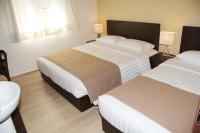 Postel nebo postele na pokoji v ubytování Rea Hotel