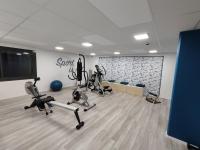 a gym with treadmills and exercise bikes in a room at Le Stratège in Marseille