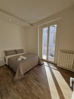 A bed or beds in a room at Amiura B&B