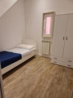 A bed or beds in a room at Amiura B&B