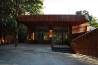 een huis met glazen deuren en een houten hek bij Coorg Coffee Bean Resort Madikeri in Madikeri