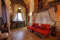 a living room with a red couch and a window at Happiness Pass On in Wujie