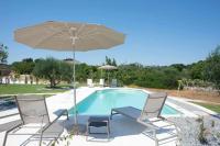 The swimming pool at or close to Dimora Maria Charming Home