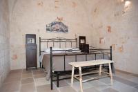 A bed or beds in a room at Dimora Maria Charming Home