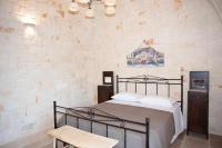 A bed or beds in a room at Dimora Maria Charming Home
