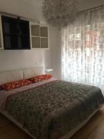 A bed or beds in a room at confortevole appartamento per 5 persone a Portuense
