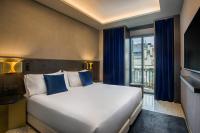 Posteľ alebo postele v izbe v ubytovaní Room Mate Collection Gerard, Barcelona