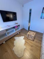 Televízia a/alebo spoločenská miestnosť v ubytovaní Apartament Poleczka Zakopane Kościelisko