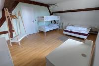 Łóżko lub łóżka w pokoju w obiekcie La villa du lac à Mesnil Saint Père