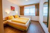 A bed or beds in a room at Apartment Bacher