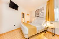 Postel nebo postele na pokoji v ubytování Hotel Viella