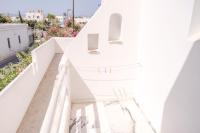 a view from the balcony of a white house at Korali Garden in Naxos Chora
