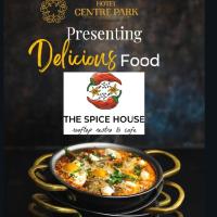 una copertina del libro raffigurante la casa delle spezie con una ciotola di cibo di Hotel Centre Park Bhopal a Bhopal