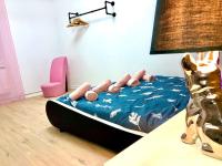 a bed in a room with a table and a lamp at La marbrière, Parking gratuit, proche centre ville in Sens
