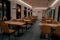 a row of tables and chairs in a restaurant at Salla Wilderness Lodges in Salla