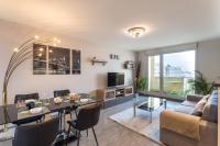 Televízia a/alebo spoločenská miestnosť v ubytovaní Le Lounge - 2 chambres avec parking