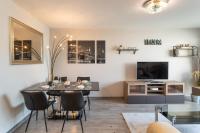 Televízia a/alebo spoločenská miestnosť v ubytovaní Le Lounge - 2 chambres avec parking