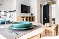 Televízia a/alebo spoločenská miestnosť v ubytovaní CALMA Apartments