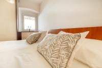 Postel nebo postele na pokoji v ubytování Apartments Regjo
