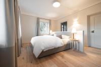 Posteľ alebo postele v izbe v ubytovaní Smart Suites Kaltern - Apartments am Kalterer See