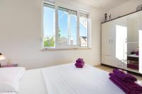 Postel nebo postele na pokoji v ubytování Apartments Regjo