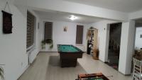 a living room with a pool table in it at Camera de la Bunici - o poarta catre oriunde 