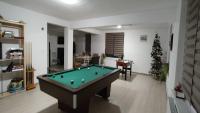 a living room with a pool table and a christmas tree at Camera de la Bunici - o poarta catre oriunde 