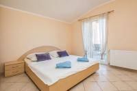 Postel nebo postele na pokoji v ubytování Apartments Hrskanovic