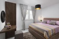 Posteľ alebo postele v izbe v ubytovaní Apartments Vista Exclusive