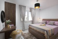 Posteľ alebo postele v izbe v ubytovaní Apartments Vista Exclusive