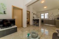 Televízia a/alebo spoločenská miestnosť v ubytovaní Apartments Stichling