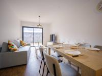 a dining room with a table with wine glasses on it at Appartement Loudenvielle, 3 pièces, 6 personnes - FR-1-695-17 in Loudenvielle