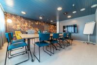 a conference room with a table and chairs at Hotel Sparre in Porvoo