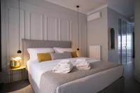 Posteľ alebo postele v izbe v ubytovaní K23 Color Suites