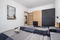 Posteľ alebo postele v izbe v ubytovaní Apartman Arba