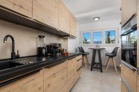 Kuchyňa alebo kuchynka v ubytovaní Apartman Arba
