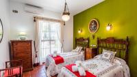 A bed or beds in a room at Casa Campo La Capilla Los Palacios y Villafranca by Ruralidays