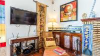 A television and/or entertainment centre at Casa Campo La Capilla Los Palacios y Villafranca by Ruralidays