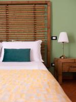 A bed or beds in a room at Kalamarina Rooms