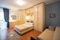 A bed or beds in a room at Kalamarina Rooms
