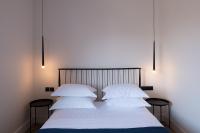 A bed or beds in a room at City's Best-Kept Secret, Eclectic & Luxe Getaway