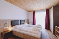 Łóżko lub łóżka w pokoju w obiekcie Appartements Sulzer by we rent, SUMMERCARD INCLUDED