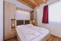 Łóżko lub łóżka w pokoju w obiekcie Appartements Sulzer by we rent, SUMMERCARD INCLUDED