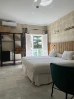 Posteľ alebo postele v izbe v ubytovaní Alameda Hostal Boutique