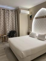 Posteľ alebo postele v izbe v ubytovaní Alameda Hostal Boutique