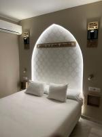 Posteľ alebo postele v izbe v ubytovaní Alameda Hostal Boutique