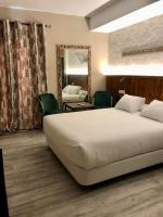Posteľ alebo postele v izbe v ubytovaní Alameda Hostal Boutique