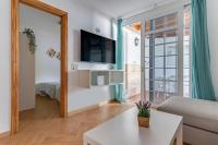 Televízia a/alebo spoločenská miestnosť v ubytovaní Home2Book Terrace&Pool Apartment Playa del Inglés